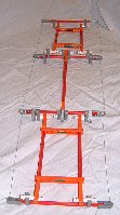 Chain toy - Shows the K'nex model strung with black thread on both sides