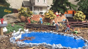 A farmhouse and boys fishing.